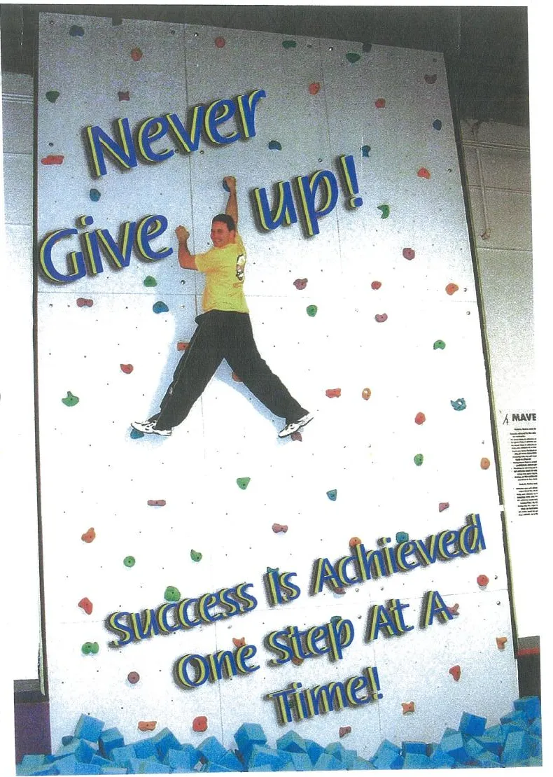“Never give up. Success is achieved one step at a time.” The Maverick climbing wall
